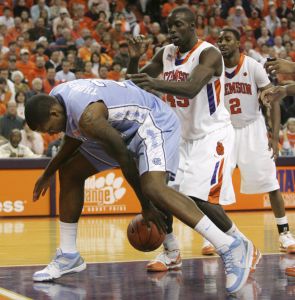 North Carolina's Deon Thompson (21) loses control of the ball under the basket as Clemson's Jerai Grant (45) watches during the first half of an NCAA college basketball game Wednesday, Jan. 13, 2010, in Clemson, S.C. (AP Photo/Mary Ann Chastain)