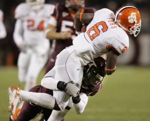 Clemson wide receiver Jacoby Ford (6) tries to break the tackle of Virginia Tech defender Cory Price (48) during the Clemson Virginia Tech Atlantic Coast Conference college football game in Blacksburg, Va., Thursday, Oct. 26, 2006. (AP Photo/Steve Helber)