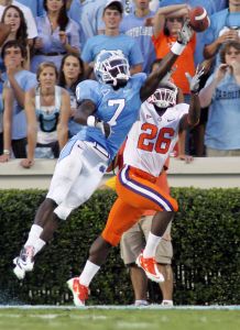 Clemson wide receiver Marquan Jones (26) goes up for a jump ball against North Carolina cornerback Mywan Jackson. (AP Photo/Jim R. Bounds