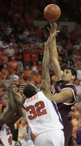 Virginia Tech's A.D. Vassallo shoots over Sam Perry during the second half. (AP Photo/Patrick Collard)