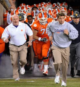 Head Coach Dabo Swinney and team running out on the field pregame