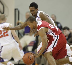 Cliff Hammonds puts pressure on Gardner-Webb's Takayo Siddle as he drives to the basket during the second half. Clemson won 96-67. (AP Photo/Patrick Collard)