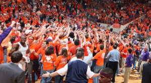 fans celebrate on court postgame