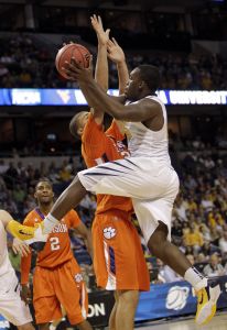 West Virginia's Darryl Bryant, right, is guarded by Clemson's Milton Jennings during the first half of an East regional second round NCAA tournament college basketball game in Tampa, Fla., Thursday, March 17, 2011. (AP Photo/John Raoux)