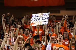 students cheer fans celebrate sign
