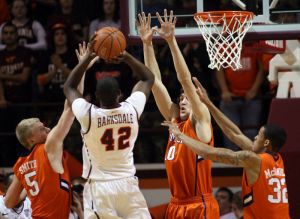 Tanner Smith, Catalin Baciu and K.J. McDaniels defense