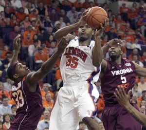 Trevor Booker drives for the basket as Virginia Tech's J.T.Thompson (33) and Dorenzo Hudson (5) defend during the first half Wednesday, Feb. 25, 2009, at Littlejohn Coliseum in Clemson, S.C. (AP Photo/Mary Ann Chastain)