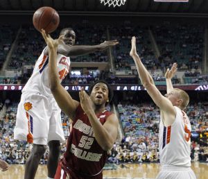 Boston College's Josh Southern (52) drives between Clemson's Jerai Grant (45) and Tanner Smith (5) in the first half of an NCAA college basketball game at the Atlantic Coast Conference tournament in Greensboro, N.C., Friday, March 11, 2011. (AP Photo/Gerry Broome)