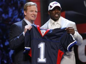 Clemson running back C.J. Spiller, right, holds up a jersey with NFL commissioner Roger Goodel after he was selected as the ninth overall pick by the Buffalo Bills in the first round of the NFL football draft at Radio City Music Hall Thursday, April 22, 2010, in New York. (AP Photo/Jason DeCrow)