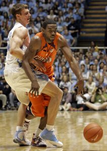 Clemson's K.C. Rivers tries to drive around North Carolina's Tyler Hansbrough, left, during the second half of a college basketball game in Chapel Hill, N.C., Sunday, Feb. 10, 2008. North Carolina won 103-93 in double overtime. (AP Photo/Gerry Broome)