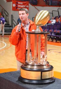 Dabo Swinney with trophy, halftime