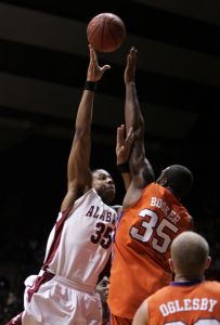 Clemson's Trevor Booker tries to block a shot from Alabama's Richard Hendrix in the second half.