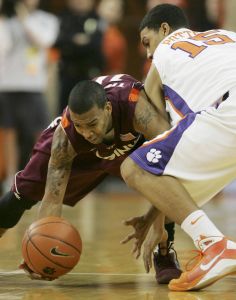 Virginia Tech's Hank Thorns (10) scoops up the ball as David Potter battles for it during the first half Wednesday, Feb. 25, 2009, at Littlejohn Coliseum in Clemson, S.C. (AP Photo/Mary Ann Chastain)