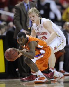 Clemson guard Andre Young, front, controls the ball against Maryland forward Haukur Palsson, back, during the second half of an NCAA college basketball game, Saturday, Jan. 22, 2011, in College Park, Md. Maryland won 79-77. (AP Photo/Nick Wass)