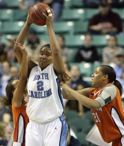 North Carolina's Erlana Larkins keeps the ball from April Parker (21) and Morganne Campbell, left, during the second half. (AP Photo/Nell Redmond)