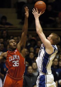 Duke's Kyle Singler, right, shoots over Clemson's Trevor Booker (35) in the second half of a basketball game in Durham, N.C., Saturday, Jan. 19, 2008. Duke won 93-80 over Clemson.