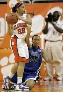 Duke's Carrem Gay (30) falls to the floor as she tries to take the ball from Clemson's Sthefany Thomas (22) during the first half of their basketball game Wednesday, Feb. 13, 2008, in Clemson, S.C. (AP Photo/Mary Ann Chastain)
