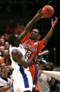Clemson's Sam Perry, back, protects the ball from Air Force's Dan Nwaelele during the first half of basketball action Tuesday, March 27, 2007 during the Semifinal round of the National Invitation Tournament at Madison Square Garden in New York. (AP Photo/Frank Franklin II)