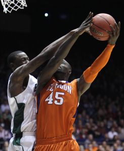 Clemson center Jerai Grant (45) goes up strong against UAB forward Cameron Moore in the first half of a first-round NCAA college basketball tournament game Tuesday, March 15, 2011, in Dayton, Ohio. (AP Photo)