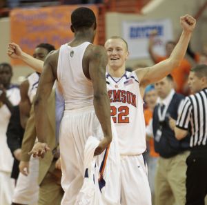Sam Perry, and Terrence Oglesby celebrate after defeating Virginia Tech, 70-69. Oglesby finished with a team-high 17 points for the game. (AP Photo/Patrick Collard)