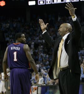 Oliver Purnell reacts as K.C. Rivers passes the bench during their game against North Carolina. (AP Photo/Gerry Broome)