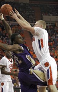 Western Carolina guard Harouna Mutombo, left, blocks a shot attempt by Clemson guard Tanner Smith, right, during the first half of an NCAA college basketball game Tuesday, Dec. 22, 2009, at Littlejohn Coliseum, in Clemson, S.C. (AP Photo/Brett Flashnick)