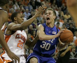 Duke's Jon Scheyer (30) runs into Clemson's Cliff Hammonds (25) as he drives for the basket during the first half of their basketball game Thursday, Feb. 22, 2007, at Littlejohn Coliseum in Clemson, S.C. (AP Photo/Mary Ann Chastain)