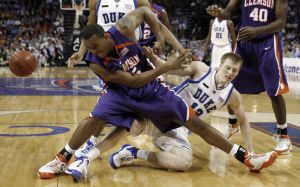Trevor Booker and Duke's Kyle Singler tangle as they vie for a rebound during the first half. (AP Photo/Steve Helber)