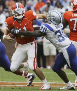 Clemson's quarterback Kyle Parker (11) stiff arms Middle Tennessee State's Cam Robinson (30). (AP)