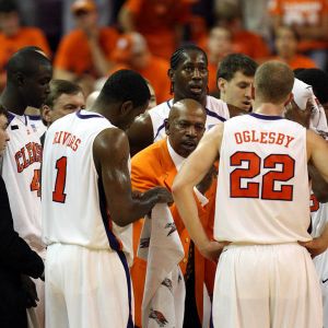 head coach oliver purnell in team huddle during timeout