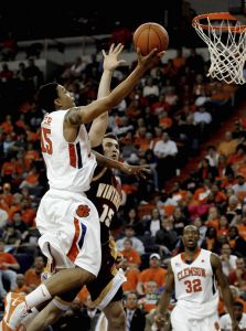 Clemson's David Potter (15) converts a steal to score over Winthrop's Andy Buechert (15), while teammate Donte Hill (32) looks on during the second half of an NCAA college basketball game Monday, Nov. 23, 2009, at Littlejohn Coliseum in Clemson, S.C. Clemson defeated Winthrop 102-66. (AP Photo/Richard Shiro)