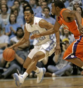 North Carolina's Wayne Ellington, left, drives the ball upcourt as Clemson's K.C. Rivers defends during the first half of a college basketball game in Chapel Hill, N.C., Sunday, Feb. 10, 2008. North Carolina won 103-93 in double overtime. (AP Photo/Gerry Broome)