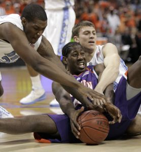 James Mays fights North Carolina's Deon Thompson, left, and Tyler Hansbrough for a loose ball. (AP Photo/Steve Helber)