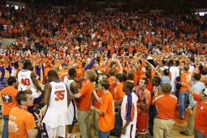 fans crowd cheer celebrate postgame on court