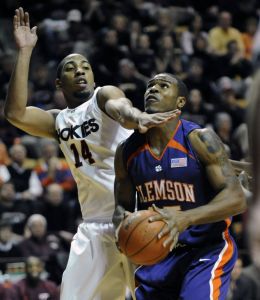 Virginia Tech's Victor Davila, left, tries to block the shot of Clemson's Trevor Booker during the first half of an NCAA college men's basketball game at Cassell Coliseum in Blacksburg, Va.,Thursday, Jan. 29, 2009.