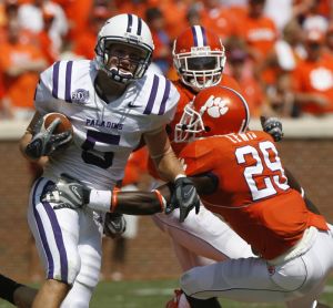 Clemson's Haydrian Lewis (29) reaches to make a tackle against Furman's Patrick Sprague (5) during a college football game in Clemson, S.C., Saturday, Sept. 15, 2007. (AP Photo/Patrick Collard)