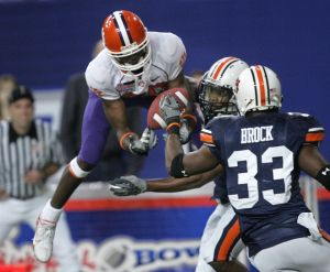Auburn defensive back Matthew Motley, center, breaks up a pass intended for Clemson's Aaron Kelly, left, as Auburn's Eric Brock (33) closes in during the first quarter of the Chick-fil-A Bowl football game Monday, Dec. 31, 2007, in Atlanta. (AP Photo/John Bazemore)