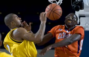 Clemson forward Bryan Narcisse, right, fouls Long Beach State forward Eugene Phelps during the second half of n NCAA college basketball game in the 76 Classic in Anaheim, Calif., Friday, Nov. 27, 2009. Clemson won 87-79. (AP Photo/Chris Carlson)