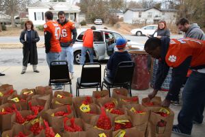 Members of the Clemson football team spent the morning of Monday, December 20 volunteering at Harvest Hope Food Bank in Greenville.