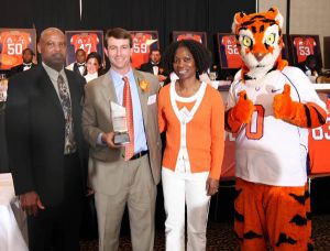 Aaron Kelly's parents accepted the Solid Rock Award on the wide receiver's behalf.