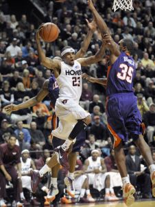 Virginia Tech's Malcolm Delaney goes to the basket against Clemson's Trevor Booker, right, during an NCAA college basketball game in Blacksburg, Va.,Thursday, Jan. 29, 2009.