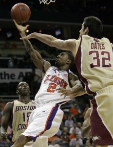 Demontez Stitt drives past John Oates as Rakim Sanders looks on in the first half.