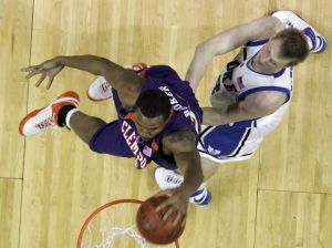 Trevor Booker, left, dunks as Duke's Kyle Singler, right, defends during Clemson's 78-74 win. (AP Photo/Gerry Broome)