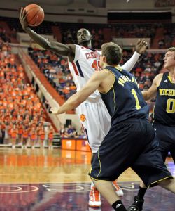 Clemson's Jerai Grant, back, grabs a rebound in front of Michigan's Stu Douglass (1) in the first half of their NCAA basketball game at Littejohn Coliseum in Clemson, S.C. on Tuesday, Nov. 30, 2010. (AP Photo/Anderson Independent-Mail, Mark Crammer)