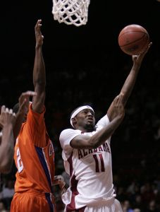 Alabama's Rico Pickett goes in for a lay-up over Clemson's Demontez Stitt in the second half.