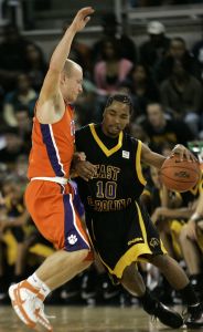 Terrence Oglesby, left, pressures East Carolina's Brock Young (10) during the second half of a college basketball game in Greenville, N.C., Wednesday, Dec. 5, 2007. Clemson won 82-67. (AP Photo/Gerry Broome)