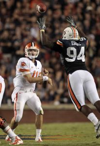 Clemson quarterback Kyle Parker (11) throws over the defense of Auburn's Nosa Equae (94) in the first half of their NCAA college football game at Jordan-Hare Stadium in Auburn, Ala., Saturday, Sept. 18, 2010. (AP Photo/Dave Martin)