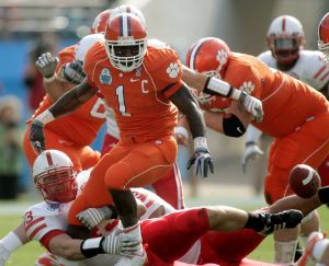 Clemson running back James Davis (1) watches his first-quarter fumble as Nebraska defensive tackle Ty Steinkuhler makes the tackle during the Gator Bowl.(AP Photo/Phil Coale)