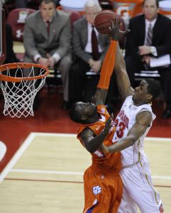 Clemson's Jerai Grant, left, goes up to block Maryland forward Dino Gregory during the second half of an NCAA college basketball game, Saturday, Jan. 22, 2011, in College Park, Md. (AP Photo/Nick Wass)