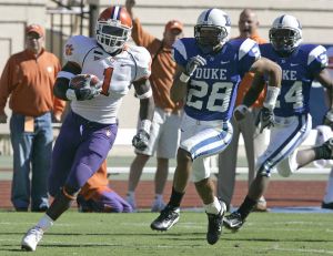 James Davis runs for a 70 yard touchdown as Duke's Adrian Aye-Darko (28) and Glenn Williams give chase during the second half. (AP Photo/Gerry Broome)